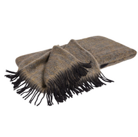 A folded Diana Mohair Throw by Mantas Ezcaray, featuring a brown and gray plaid pattern with black fringed edges, is displayed on a white background.