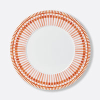 Bernardaud Terra Rosa Dinnerware: round white plate with a decorative border of alternating red and orange geometric lines and rectangles, plain white center. Made in Limoges, France.