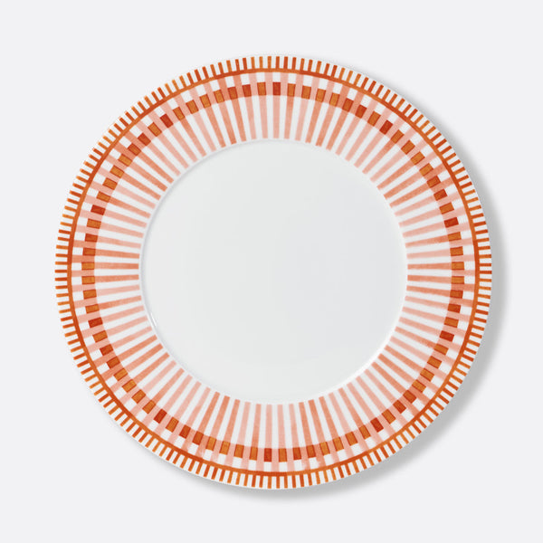 Bernardaud Terra Rosa Dinnerware: round white plate with a decorative border of alternating red and orange geometric lines and rectangles, plain white center. Made in Limoges, France.