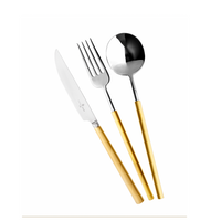 The Vista Alegre Domo Matt Gold Flatware 5 Piece Setting features elegant silver heads and gold-toned handles, including a knife, fork, and spoon, stylishly arranged on a white background.