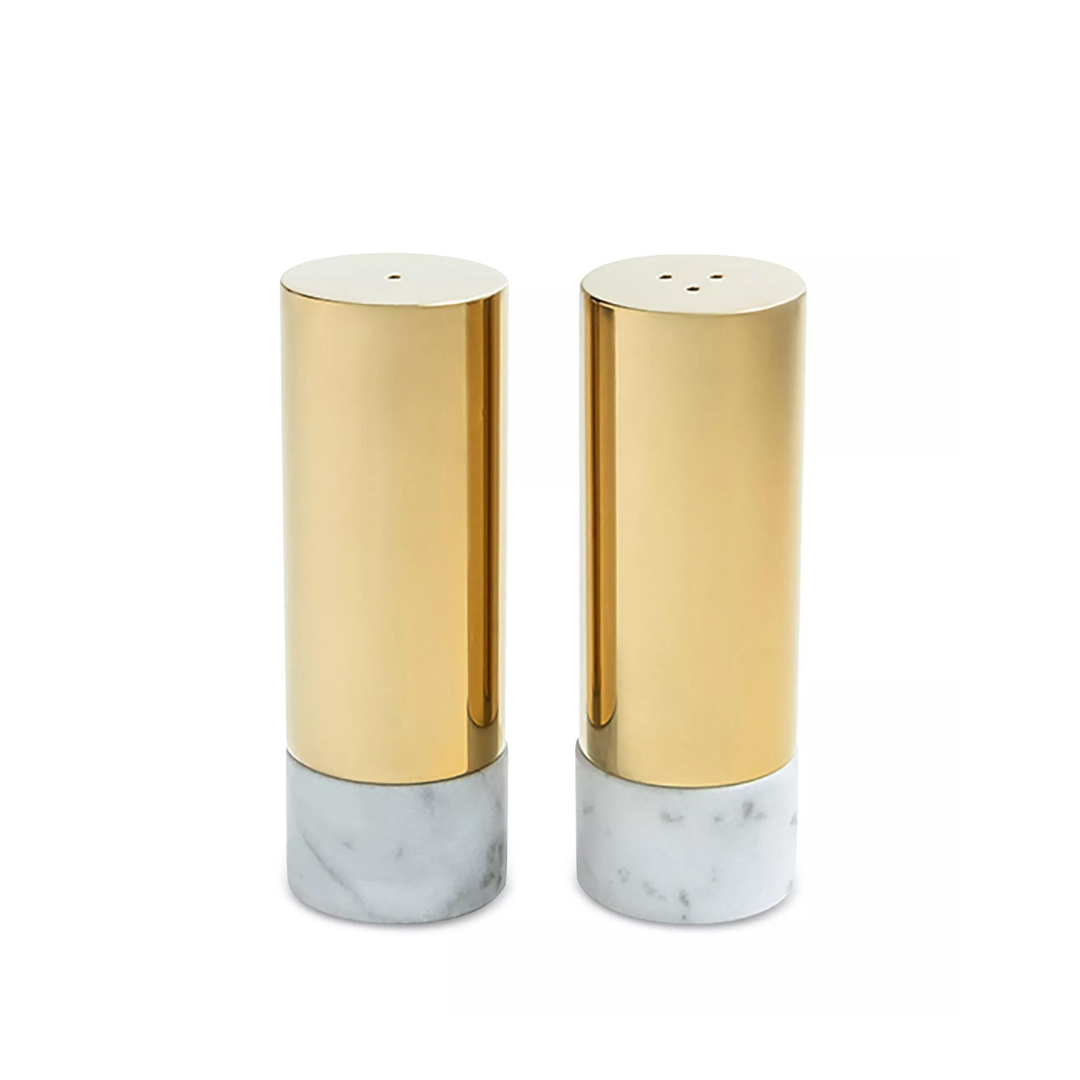 The Anna New York Dual Salt & Pepper Shakers Marble & Gold Set of 2 features two cylindrical shakers with Italian Carrara marble bases and gold metal tops, displayed side by side for a modern luxe touch.
