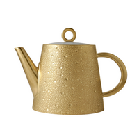 The Ecume Gold Tea - Coffee Pot by Bernardaud features a round handle and lid, a textured, dotted surface, and a sleek angled spout, capturing refined elegance reminiscent of Limoges dinnerware against a white background.