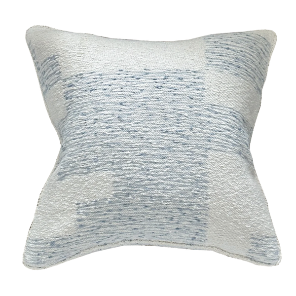 The Elements Pillow Azure by Threads Soft Goods features a square jacquard design with a light cream base and soft blue abstract stitching, adding artisanal texture and luxury to any space.