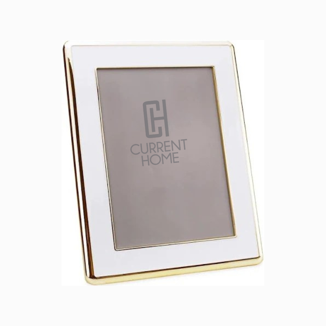The Enamel Wide Gold & White Frame by Addison Ross features elegant white enamel with gold edging. The frame stands upright at an angle and displays a placeholder with Current Home text and the CH logo.