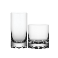 Set of four Erik Barware tumblers by Orrefors Kosta Boda, featuring clear glass with textured bases in a timeless Scandinavian design, displayed on a white background.