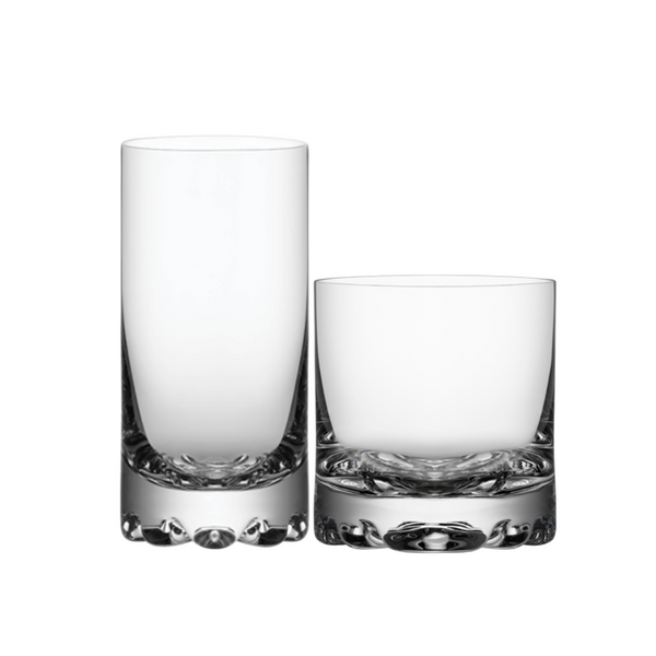 Set of four Erik Barware tumblers by Orrefors Kosta Boda, featuring clear glass with textured bases in a timeless Scandinavian design, displayed on a white background.