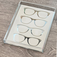 The Eye Candy Specs Eyeglass Tray neatly displays four pairs of black-framed glasses on a white background atop a light wood surface.