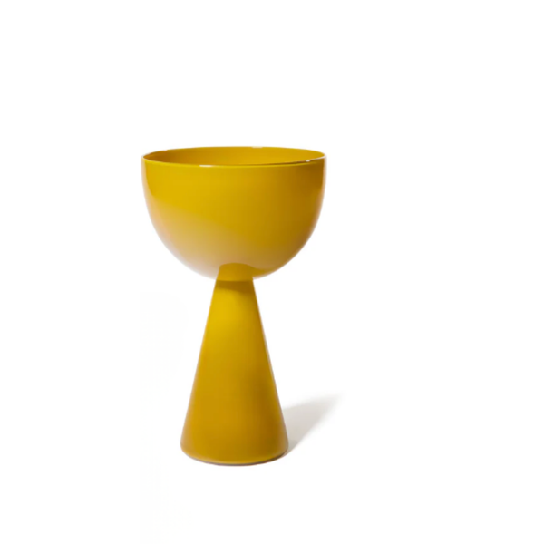 The Fiorelli Collection Mustard by Current Home NY is a modern yellow ceramic planter with a wide, round bowl on a cone-shaped base, ideal for floral arrangements and shown against a plain white background.