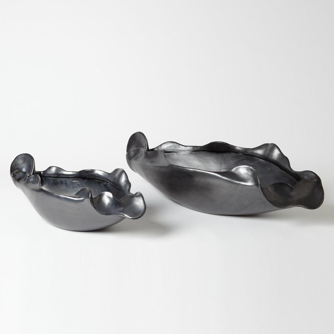 Two metallic, matte Free Form Graphite Bowls by Global Views/Surya, featuring wavy ruffled edges, are displayed side by side on a white background. One Portuguese ceramic bowl is larger than the other.