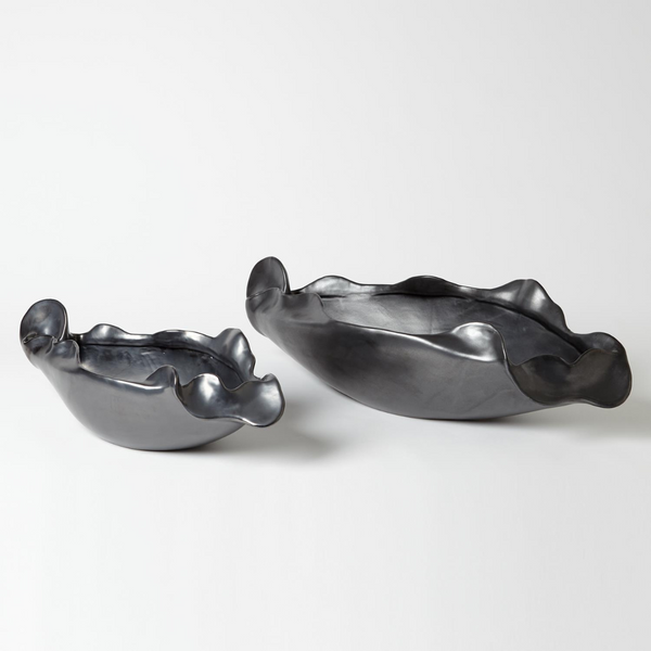 Two metallic, matte Free Form Graphite Bowls by Global Views/Surya, featuring wavy ruffled edges, are displayed side by side on a white background. One Portuguese ceramic bowl is larger than the other.