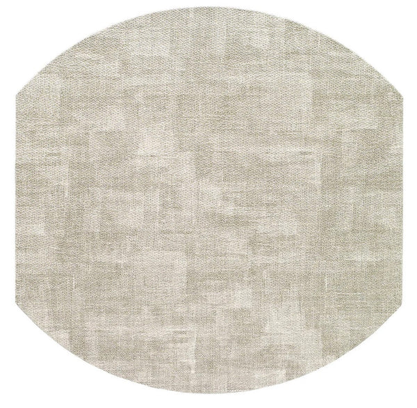 The Bodrum New Luster Elliptic Placemat in Granite (Set of 4) features a round, light beige design with a subtle textured pattern and angled edges, shown against a white background.