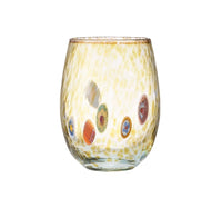 The Gala Stemless Tumbler Set 4 by Kim Seybert features clear, rounded tumblers adorned with a yellow speckled pattern and colorful circular decorations around the sides, showcasing vibrant glassware inspired by Murano Glass artistry.