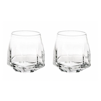 Two clear Gemstone Crystal DOF tumblers from Vista Alegre, featuring faceted bases and rounded sides, are made in Portugal and shown side by side on a white background.