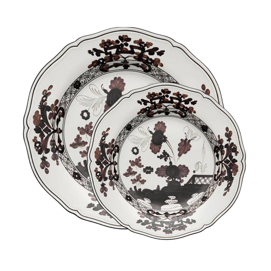 Two Oriente Italiano Dinnerware Albus plates by Ginori 1735, with scalloped edges, black and maroon floral pattern, and intricate border design, are stacked together against a white background.