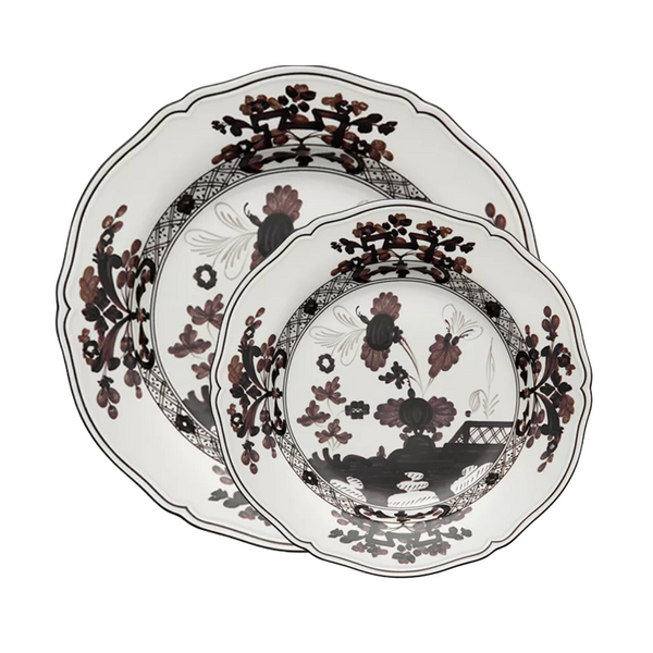 Two Oriente Italiano Dinnerware Albus plates by Ginori 1735, with scalloped edges, black and maroon floral pattern, and intricate border design, are stacked together against a white background.