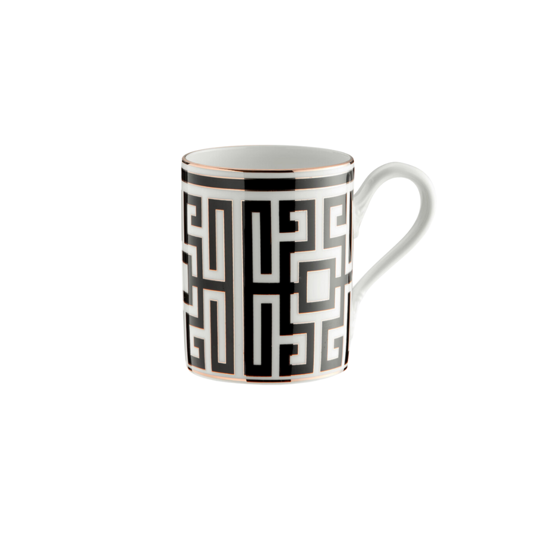 The Ginori 1735 Labirinto Dinnerware Nero mug features a black Greek key pattern and gold accents on white ceramic, displaying striking geometric decoration against a white background.