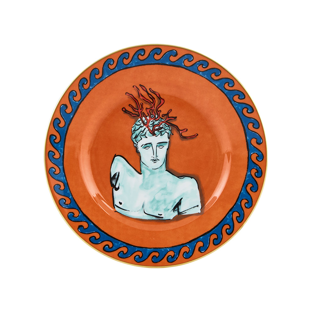The Ginori 1735 Il Viaggio Di Nettuno Dessert Plate - Rock Orange features a marble bust with red snakes, orange center, and blue wave rim—a striking Medusa-inspired piece from the luxury collection.