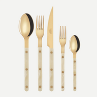 The Sabre Bistrot Horn 5 Piece Place Setting features gold-colored stainless steel cutlery with ivory handles—a large spoon, large fork, knife, small fork, and small spoon—elegantly displayed on a white background.