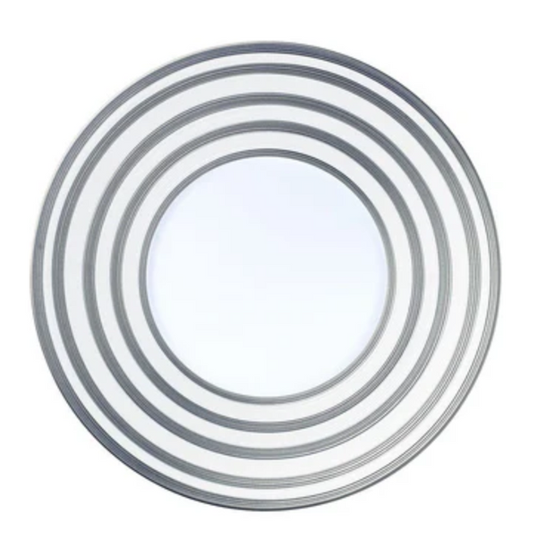 A modern round mirror from JL Coquet's Hemisphere Dinnerware Grey Stripes collection, inspired by Limoges porcelain and featuring four silver concentric rings for a symmetrical, elegant look.