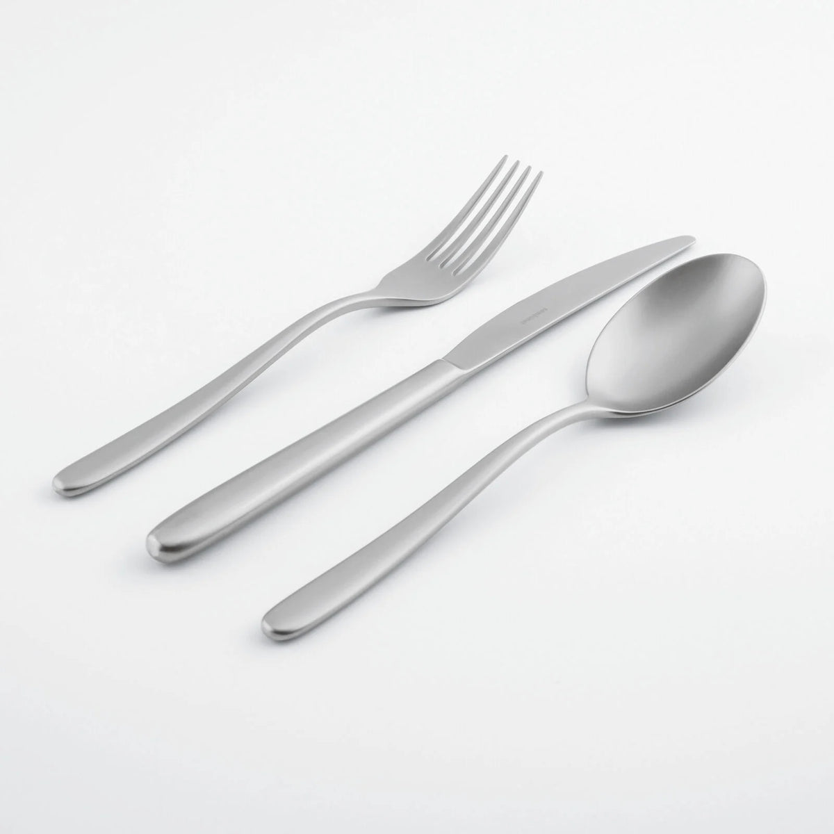 The Sambonet Hannah Antico Flatware 5 Piece Setting—featuring stainless steel utensils—is arranged diagonally on a plain white background.