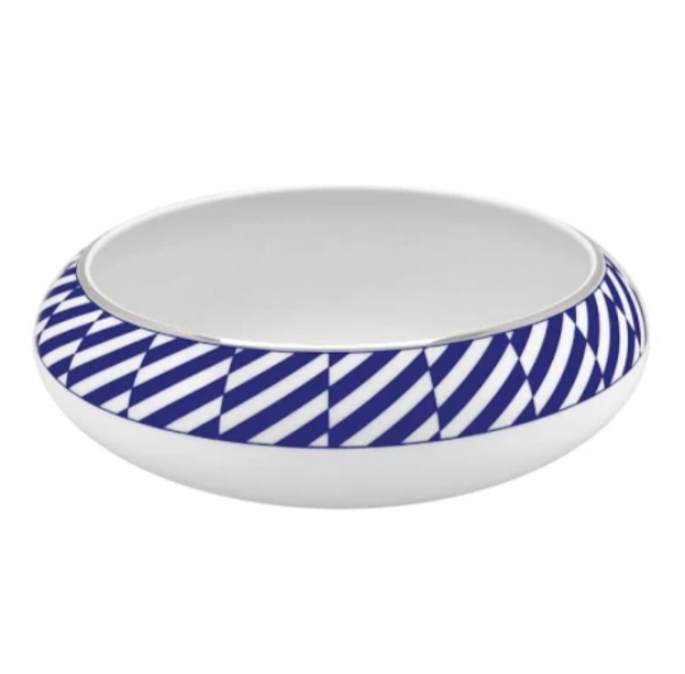 The Vista Alegre Harvard Dinnerware is a round, white porcelain bowl featuring a wide rim with blue and white diagonal stripes, bringing modern New England style to your table.