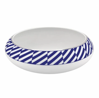 The Vista Alegre Harvard Dinnerware is a round, white porcelain bowl featuring a wide rim with blue and white diagonal stripes, bringing modern New England style to your table.