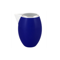 The Vista Alegre Harvard Dinnerware pitcher features a modern oval shape with a glossy blue body, white spout, and silver rim—styled in classic New England design—perfect for porcelain settings, shown on a plain white background.