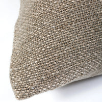 Close-up of the Hendrick Pillow Sand 20 x 20 by Pom Pom At Home, highlighting its beige, handwoven texture. The white background emphasizes the natural fibers and craftsmanship of this unique pillow.