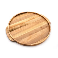 The Elmore Round Serving Board by JK Adams features light and medium-toned wood strips, a slightly raised edge, and two small handles on opposite sides. Shown here on a white background.