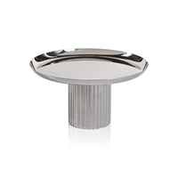 Zodax Polished Nickel Cake Stand with a wide, flat top and a thick, fluted cylindrical base.