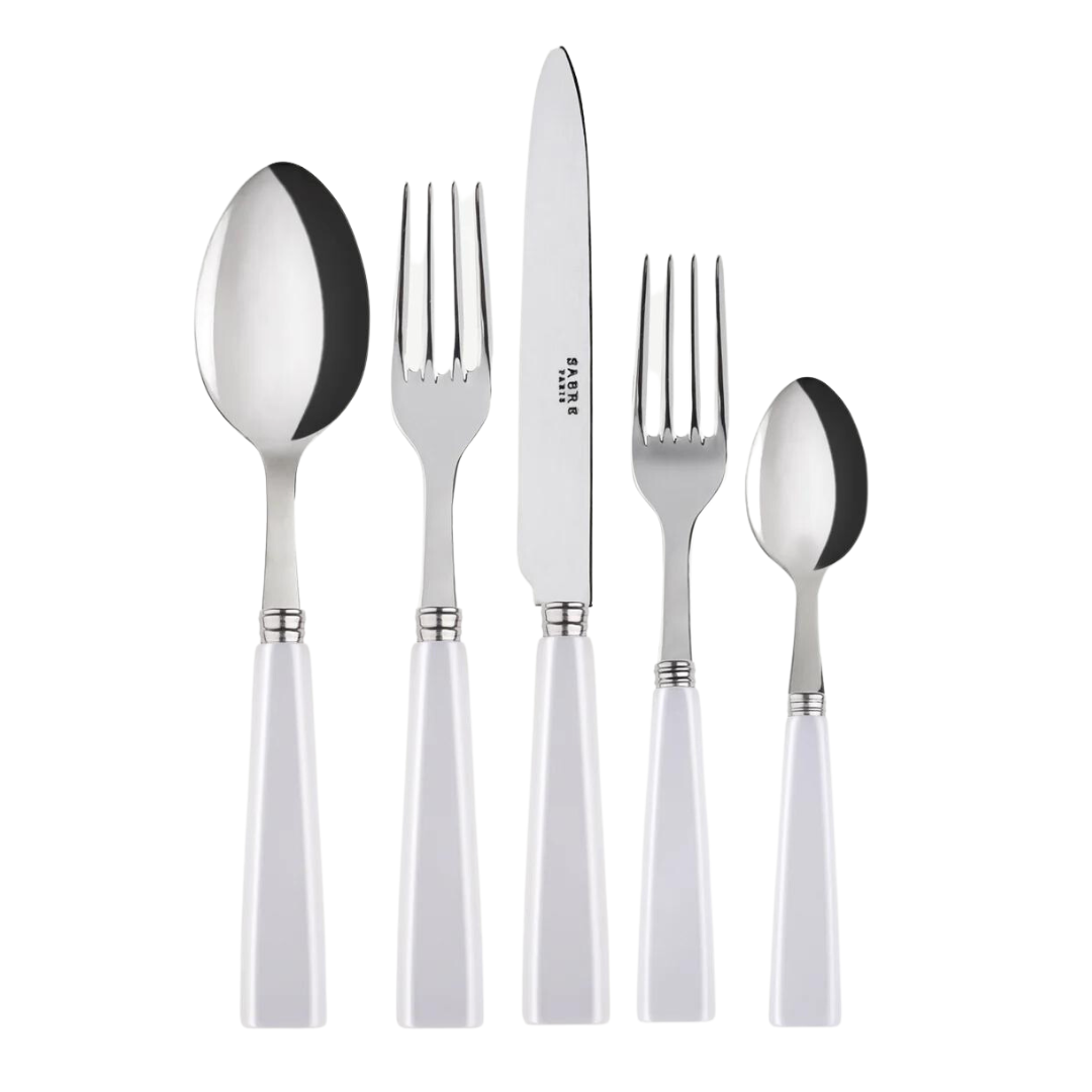 The Sabre Icone Flatware 5 Piece Setting features 18/10 stainless steel utensils with white handles, including a large spoon, dinner fork, knife, salad fork, and small spoon arranged side by side on a white background.