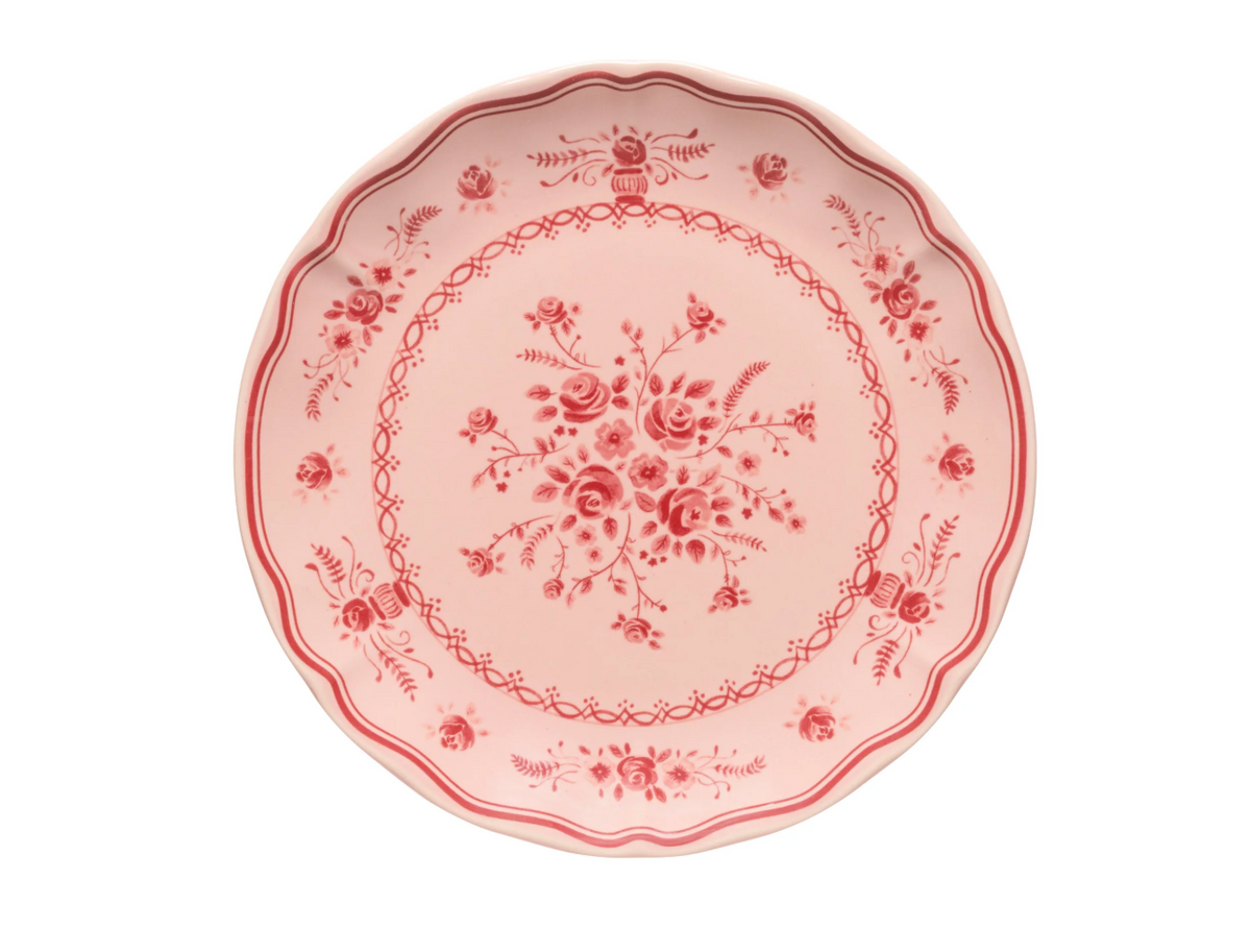 Vila Pink / Red Dessert Plate in pink stoneware with a scalloped edge and a red floral pattern.