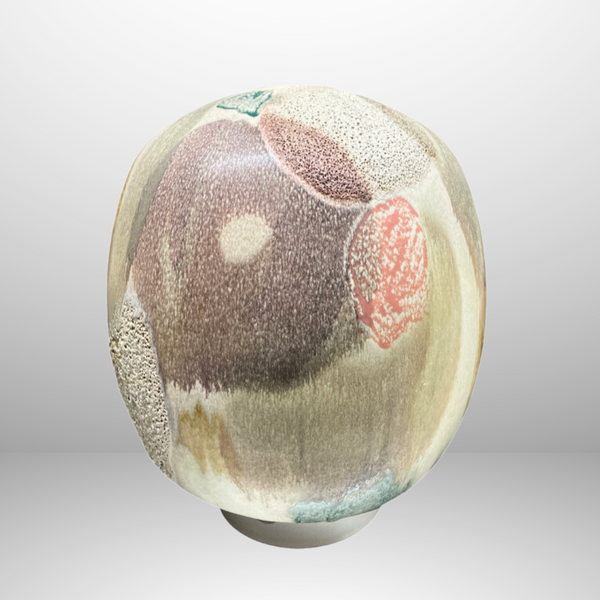 The KleinReid Rio Sugarloaf Vessel Extra Large is a round handcrafted ceramic vase with an abstract design in muted earth tones, textured patches, and soft spots of beige, brown, green, and hints of red—ideal for Rio-inspired decor.