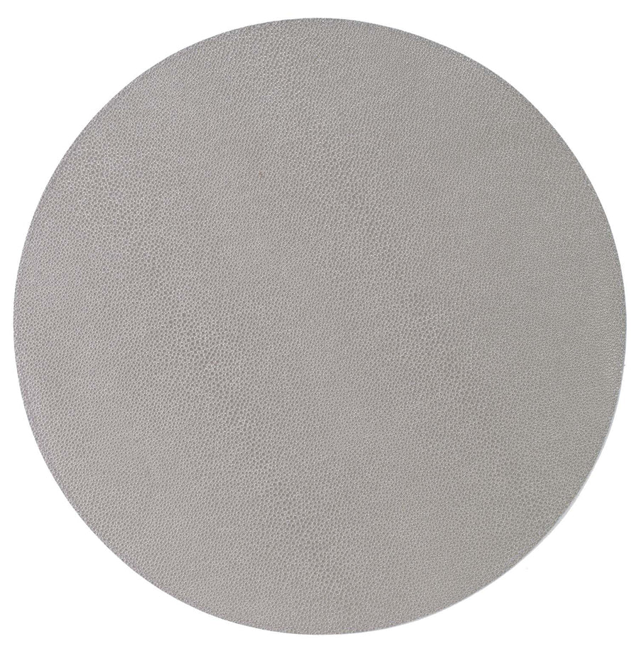 The Bodrum Skate Round Placemat Grey Set of 4 features round, light gray, leather-like textured surfaces made of phthalate-free vinyl, shown from above against a white background.