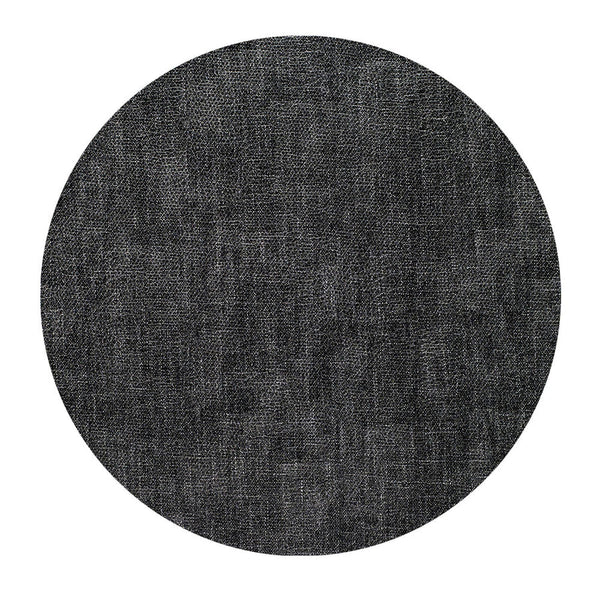 A round, dark gray textured fabric swatch, shown on a white background, represents the Bodrum New Luster Round Placemat Smoke Set of 4 (DD), featuring elegant woven fabric with subtle shading variations and a mottled appearance.
