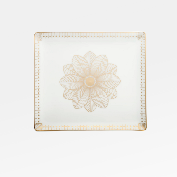 The Malmaison Porcelain Catchall Tray by Christofle is a square white Limoges porcelain piece with gold geometric accents, a detailed gold flower at the center, and Malmaison Impériale gold edging on the corners.