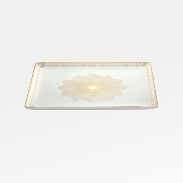 The Christofle Malmaison Porcelain Catchall Tray features an intricate gold floral centerpiece and a geometric gold rim, showcasing elegant Malmaison Impériale style against a classic white background.