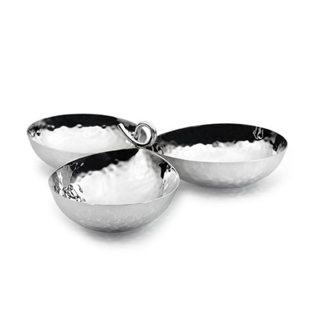 The Galaxy 3 Bowl Server by Mary Jurek features three round, hammered stainless steel bowls joined by a central metal loop, highlighting its modern design against a white background.