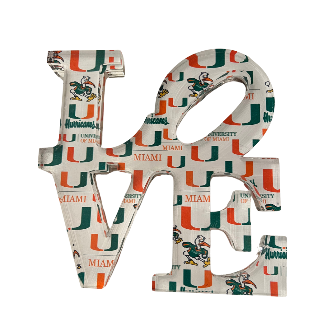 The Eye Candy College Love Sculpture features University of Miami-themed designs—U logo, mascot, and school colors—making it a perfect graduation gift or custom decor piece for proud alumni.
