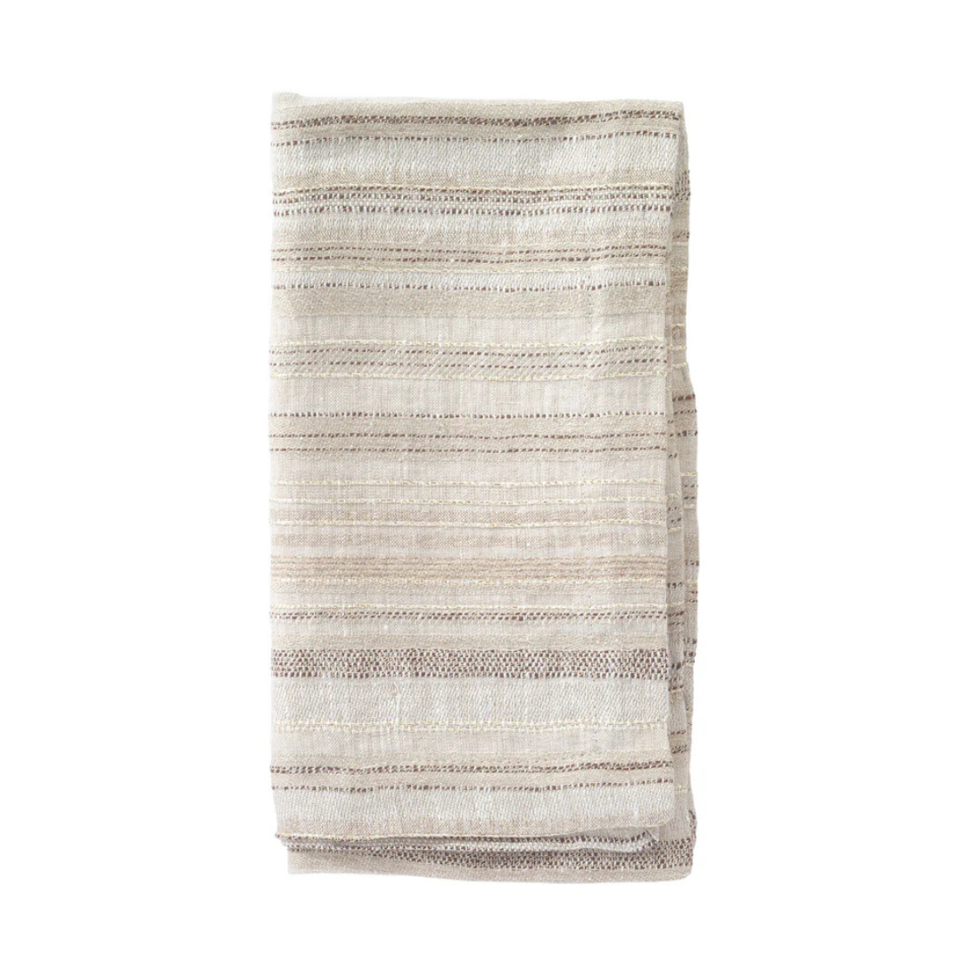 A folded, cream-colored napkin from the Bodrum Midas Napkin Set of 4, featuring subtle beige and brown horizontal stripes, is displayed on a white background.