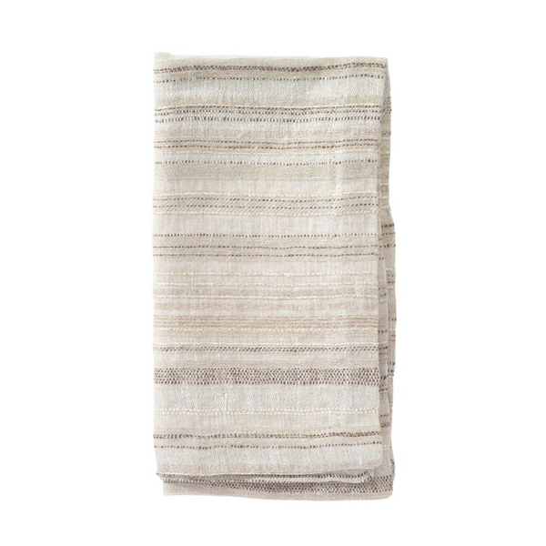 A folded, cream-colored napkin from the Bodrum Midas Napkin Set of 4, featuring subtle beige and brown horizontal stripes, is displayed on a white background.