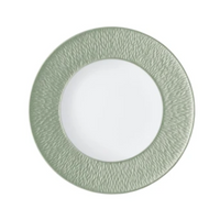 A Raynaud Mineral Irise Dinnerware - Celadon plate is shown from above, with a textured light green rim and smooth white center, set against a plain background.
