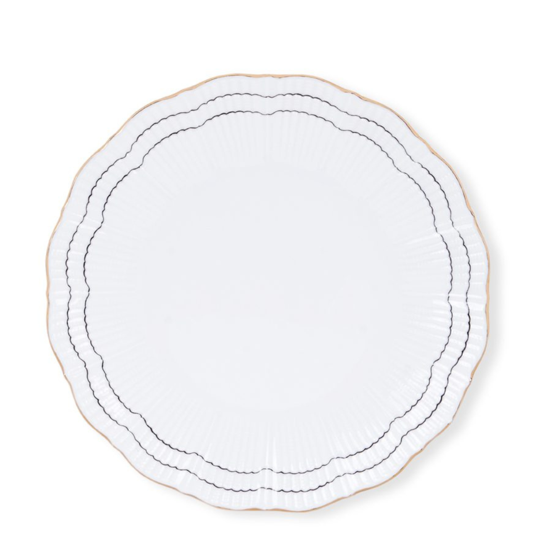 The Molecot Coral Dinnerware Black plate features scalloped porcelain, a slim gold rim, and two wavy dark lines along the border—an elegant design reminiscent of hand-painted dinnerware, shown on a plain white background.