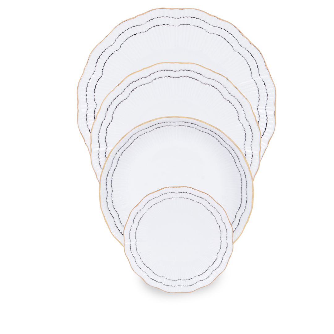 Four Coral Dinnerware Black porcelain plates by Molecot, each a different size, are stacked together. Each luxurious plate features scalloped edges, a gold rim, and thin black wavy lines for an elegant hand-painted look.