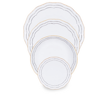 Four Coral Dinnerware Black porcelain plates by Molecot, each a different size, are stacked together. Each luxurious plate features scalloped edges, a gold rim, and thin black wavy lines for an elegant hand-painted look.