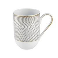The Oskar Dinnerware mug by Raynaud is a white ceramic piece inspired by Limoges porcelain, featuring a gold rim and handle with a geometric black herringbone pattern of thin diagonal lines.