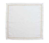A Kim Seybert Herringbone Napkin Gold & Silver Set of 4 is displayed laid flat on a plain background, featuring a decorative gold embroidered border.