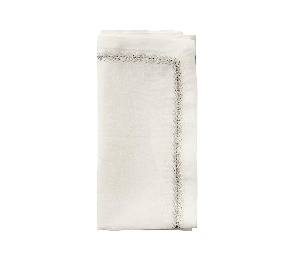 The Kim Seybert Jardin Napkin Set of 4 features neatly folded embroidered linen napkins with decorative stitched borders, displayed on a plain white background.