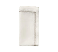 The Kim Seybert Jardin Napkin Set of 4 features neatly folded embroidered linen napkins with decorative stitched borders, displayed on a plain white background.