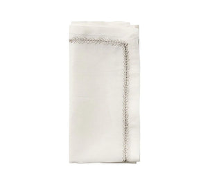 The Kim Seybert Jardin Napkin Set of 4 features neatly folded embroidered linen napkins with decorative stitched borders, displayed on a plain white background.